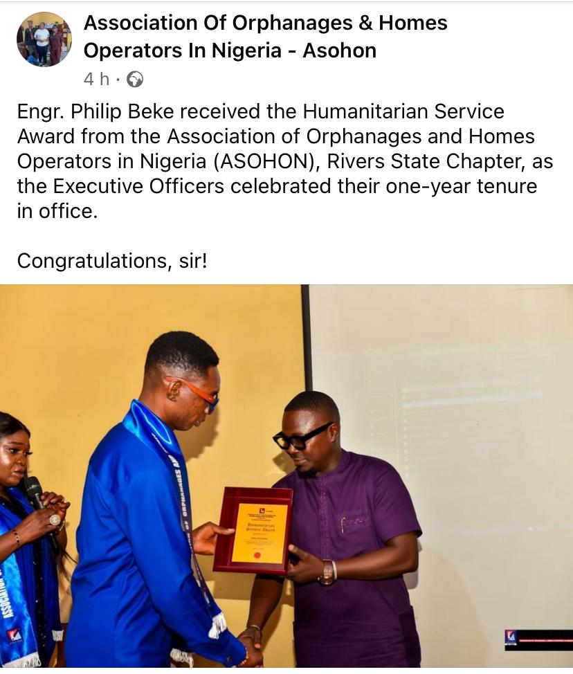 Mr Philip recieving award.